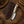 Cream sheep horn handle of farrier rasp skinner held in working grip, showing natural contour, smooth polish, comfortable secure handling, and practical ranch-ready positioning