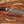 Custom D2 hunting knife with wolf engraved handle and leather sheath