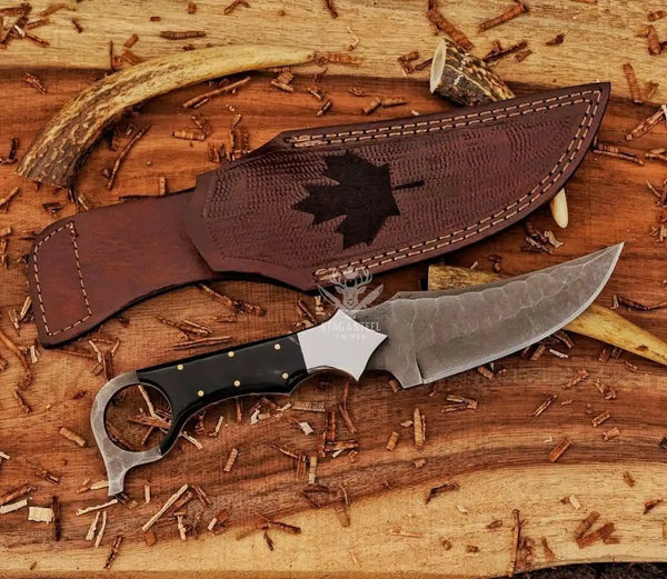Custom ringtail hunting knife with D2 steel blade and maple leaf engraved leather sheath