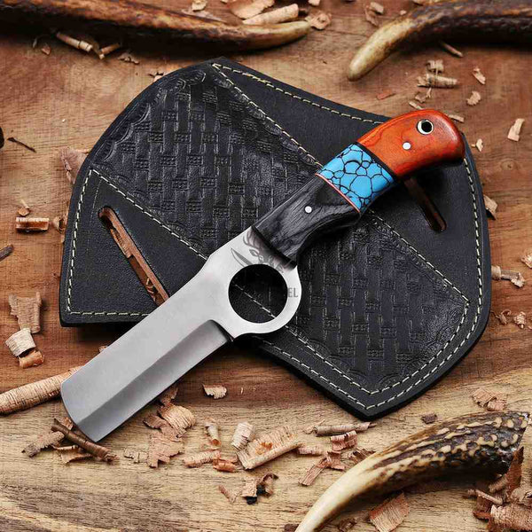 Knife with a decorative handle on a wooden surface