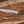 D2 rasp steel bowie knife with walnut handle on rustic wood with antlers