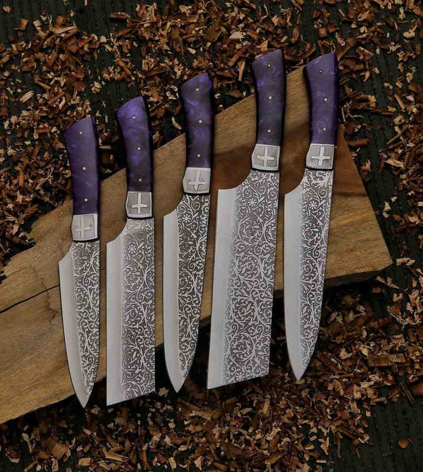 Close-up of a Damascus-style J2 chef knife with a purple resin handle