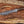 Damascus bowie knife with walnut handle on rustic wood with antlers