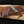 Damascus chef's knife with resin handle, snakeskin leather sheath, and wood box
