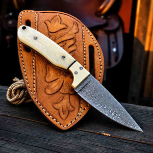 Damascus Elite Camel Bone Buckaroo knife with tooled leather pancake sheath
