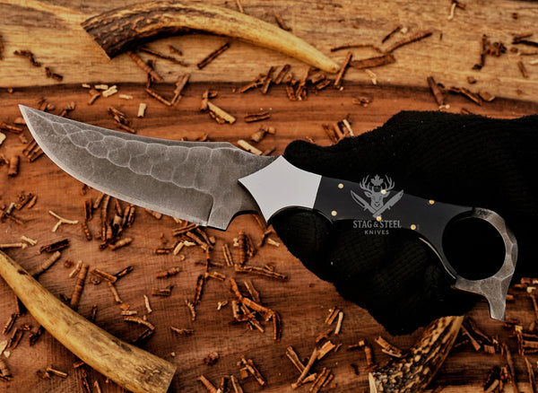 Handmade ringtail knife featuring a sharp D2 blade and bull horn handle