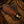 Knife secured in pancake leather sheath demonstrating fit and hand-stitched construction detail.