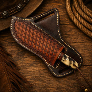 Knife secured in pancake leather sheath demonstrating fit and hand-stitched construction detail.