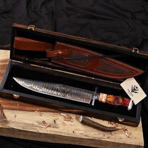 Premium Copper Damascus Bowie knife with custom resin handle and Damascus guard, presented in a handcrafted wooden display box with matching leather sheath and Stag & Steel branding.