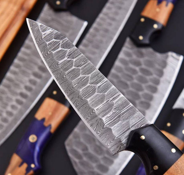 Handmade Damascus kitchen set featuring purple resin ash wood handles