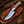 Fixed-blade rasp steel gut hook hunting knife with a pine cone handle and stainless steel bolster.