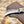 Rasp steel hawkbill knife with stag horn handle on a tooled cross draw leather sheath