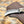 Retained rasp teeth crosshatch along the spine of a handmade hawkbill blade