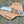 Stag horn ring pommel hawkbill knife in rasp steel on a cross draw leather sheath