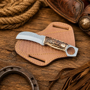 Stag horn ring pommel hawkbill knife in rasp steel on a cross draw leather sheath