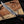 alamo musso damascus bowie knife rosewood handle in hand grip view showing handle ergonomics