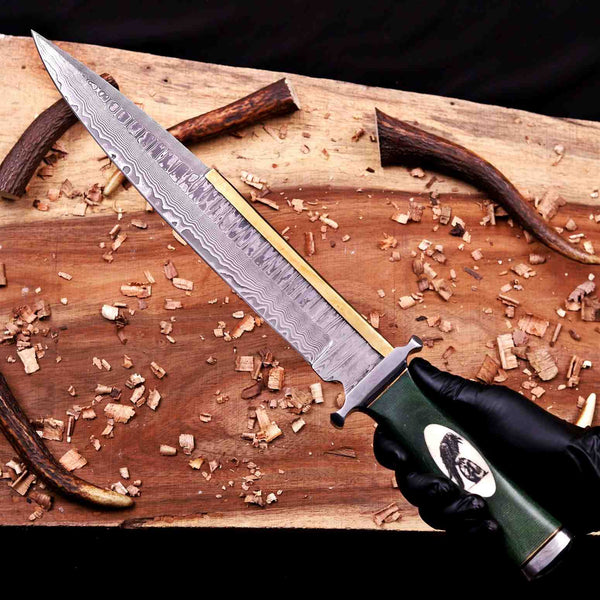 Handmade Damascus Arkansas toothpick bowie knife held in hand