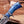 Close-up of blue marbled resin handle and Damascus spacer on finger guard bowie knife