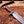 Full-tang brown micarta handle on a Damascus bowie knife