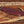 Brown leather sheath for handmade D2 machete knife with Ironwood handle and stitched edge