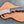 Flowing Damascus layer pattern on a handmade hawkbill knife blade