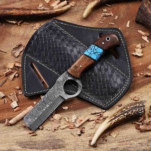 Two knives on a wooden surface with antlers and wood shavings.