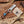 Handcrafted knife with wooden handle and turquoise inlay on a wooden surface with Stag & Steel Knives branding.