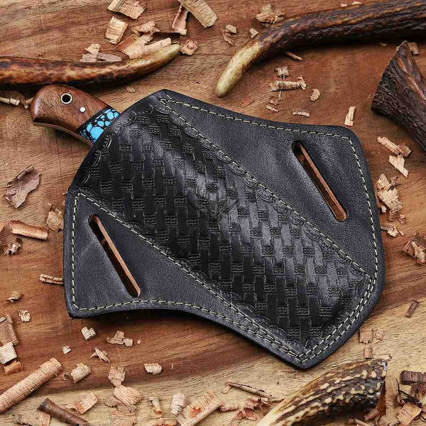 Black leather sheath with wooden handle on a wooden background
