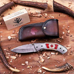 Handmade Canadian Damascus folding knife with maple leaf Italian leather sheath and camel bone Canada flag handle