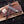 Collector grade Feather Damascus bowie knife displayed at an angle with wooden store box