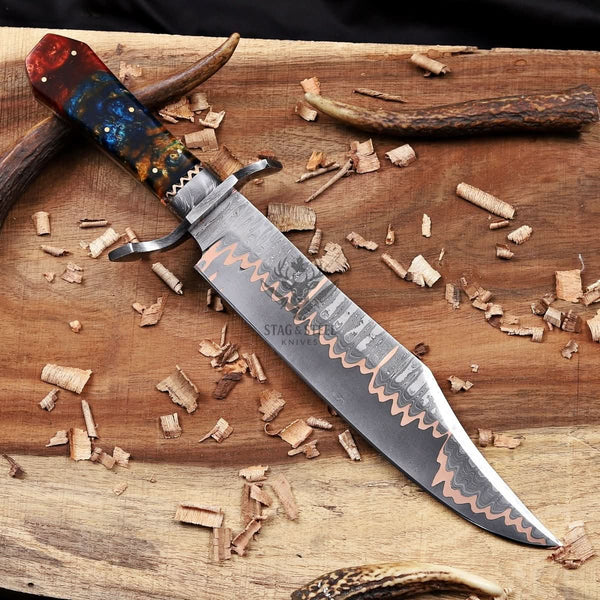 Handforged copper damascus bowie knife with damascus Guard and resin handle.