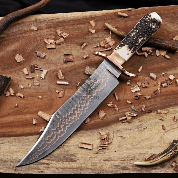 copper damascus bowie knife closeup view