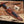 copper Damascus Bowie knife inside custom leather sheath