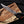 copper Damascus Bowie knife sin hand showing perfect handle grip.