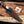 Copper Damascus bowie knife inside leather sheath carry view