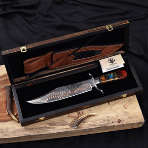 copper Damascus Bowie knife displayed with leather sheath in a wooden box