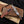 copper Damascus Bowie knife with resin handle on wooden box