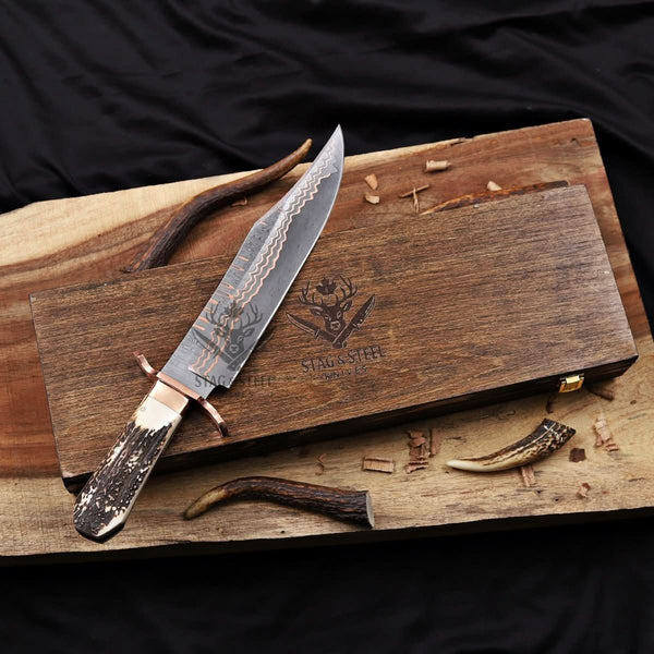 copper damascus bowie knife on wooden box