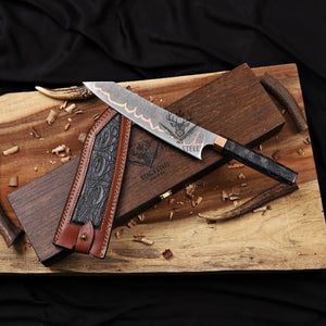 Knife with leather sheath on a wooden surface