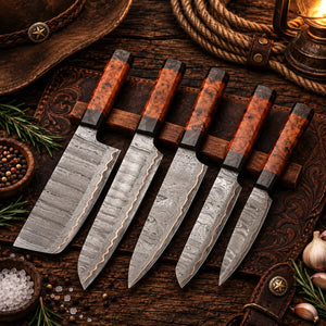 Copper Damascus knife set laid out on an open genuine leather roll