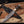 copper damascus knife with leather sheath laid flat
