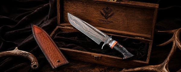 Copper Damascus knife with a sheath in a wooden box on a dark background