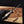 Hand holding a knife with a blurred background