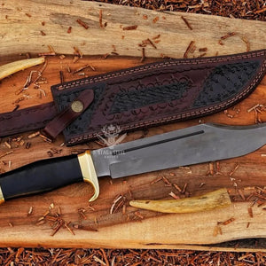 Large survival Bowie knife with polished D2 blade and black micarta grip and leather sheath