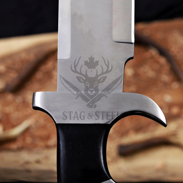 Close-up of steel guard and D2 blade on Predator bowie knife
