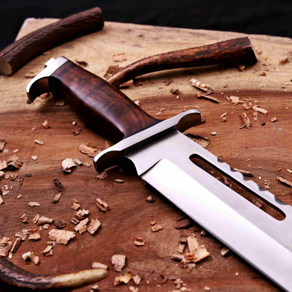Rosewood grip and steel guard macro on hand-forged D2 bowie knife