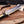 Polished D2 clip point blade with brass spine strip macro on Jim Bowie Edition knife