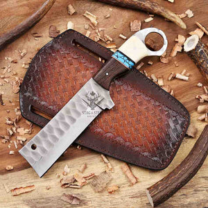 Knife with leather sheath on a wooden surface