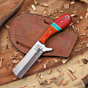 Knife with wooden handle and leather sheath on a wooden background