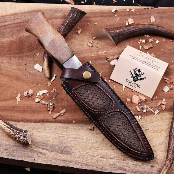 Full tang D2 hunting knife with lacewood handle in snake embossed leather sheath